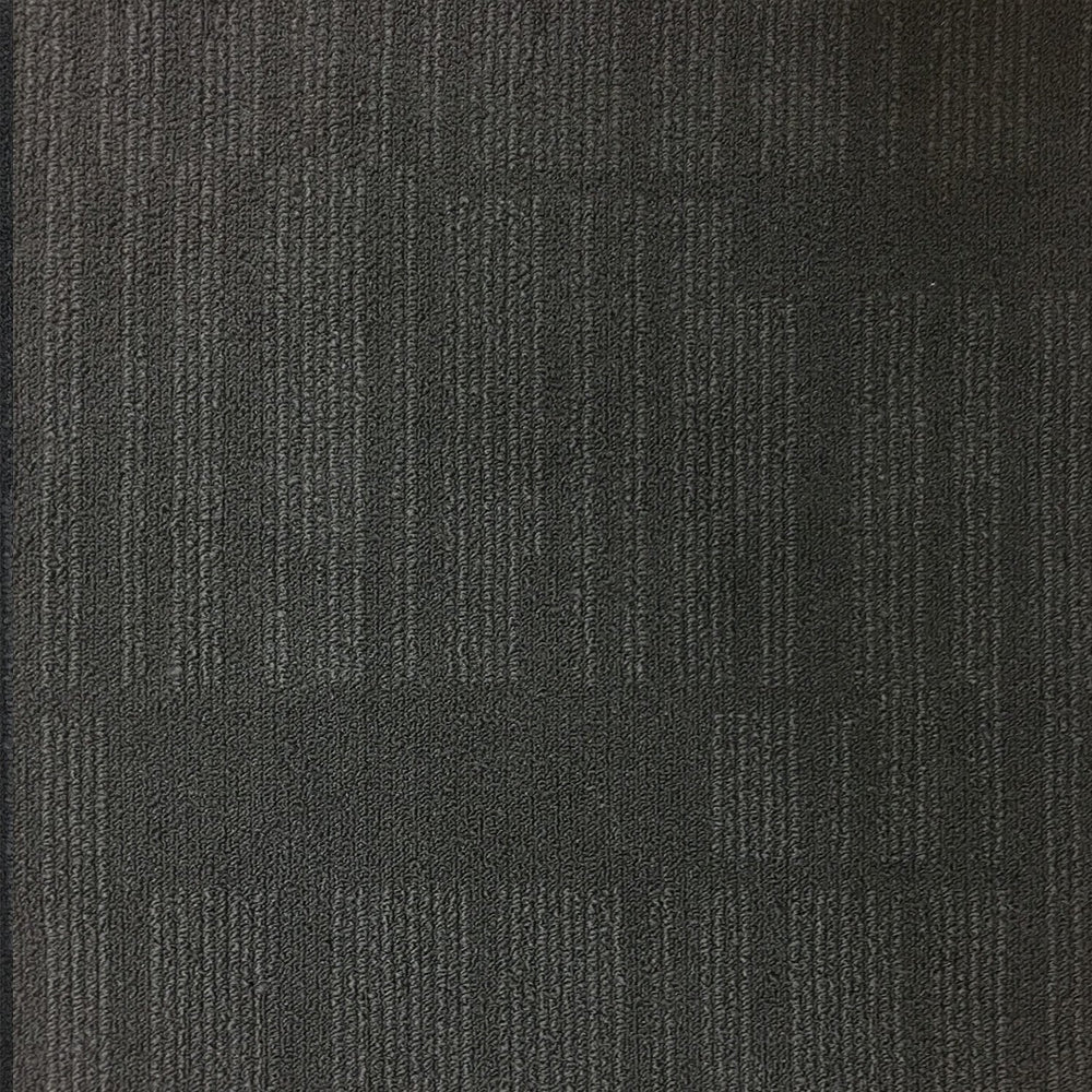 Square coal-colored carpet tiles. Textured loop pile in deep charcoal with a matte, non-reflective finish.