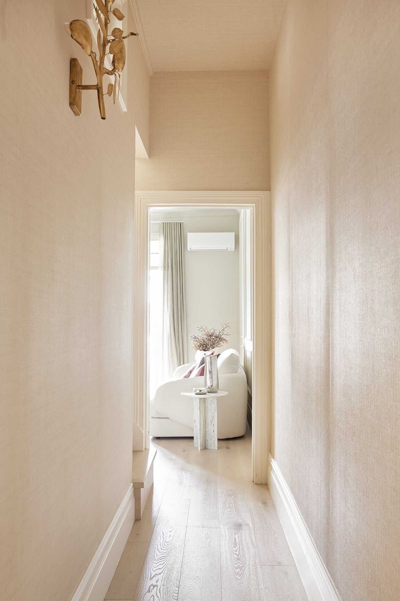 High-angle shot of Beach Oak timber flooring featuring sun-bleached tones and a fine, sandy grain texture.