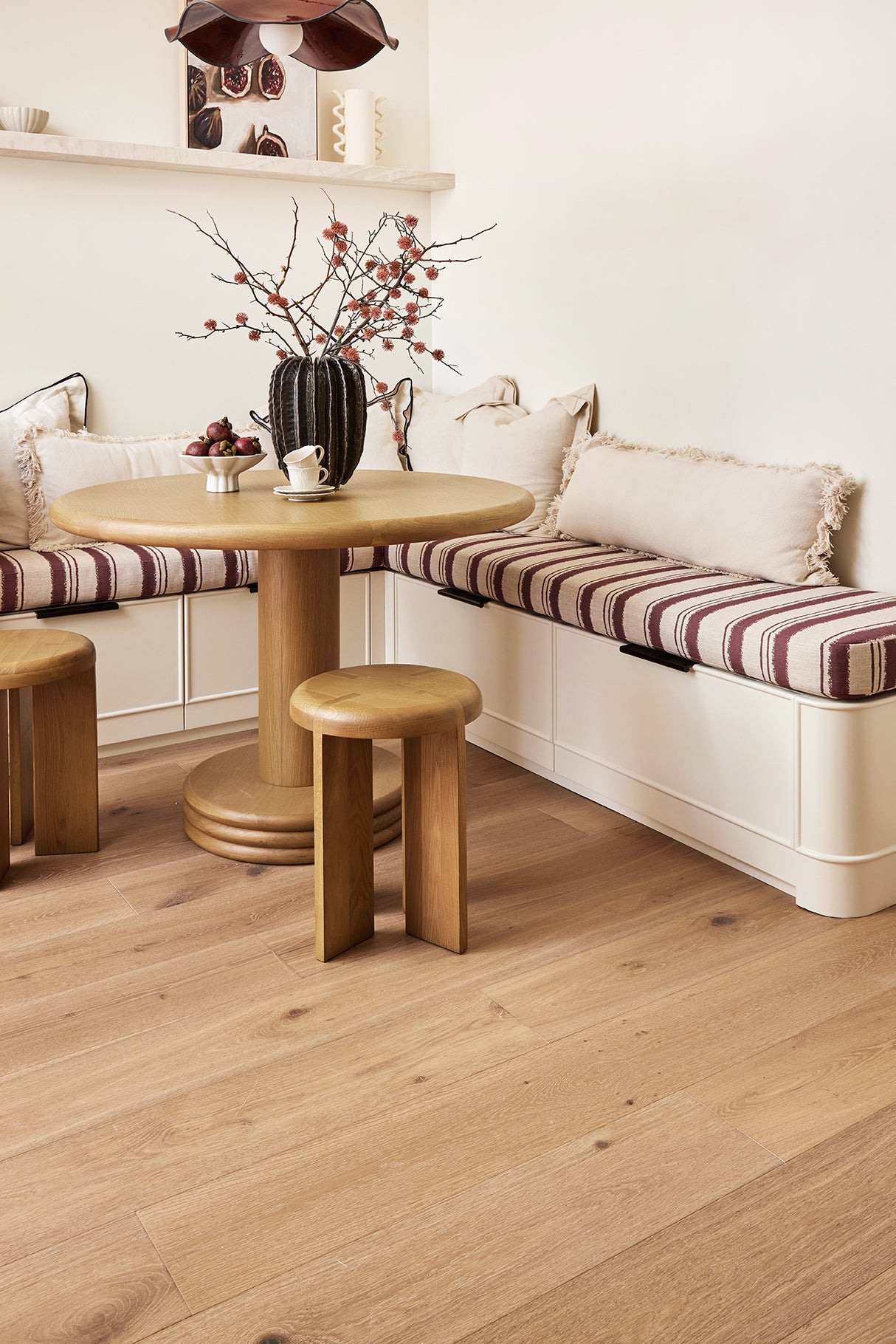 Wide-angle shot of Amalfi timber flooring, showing sandy beige tones and subtle grey undertones in the grain.