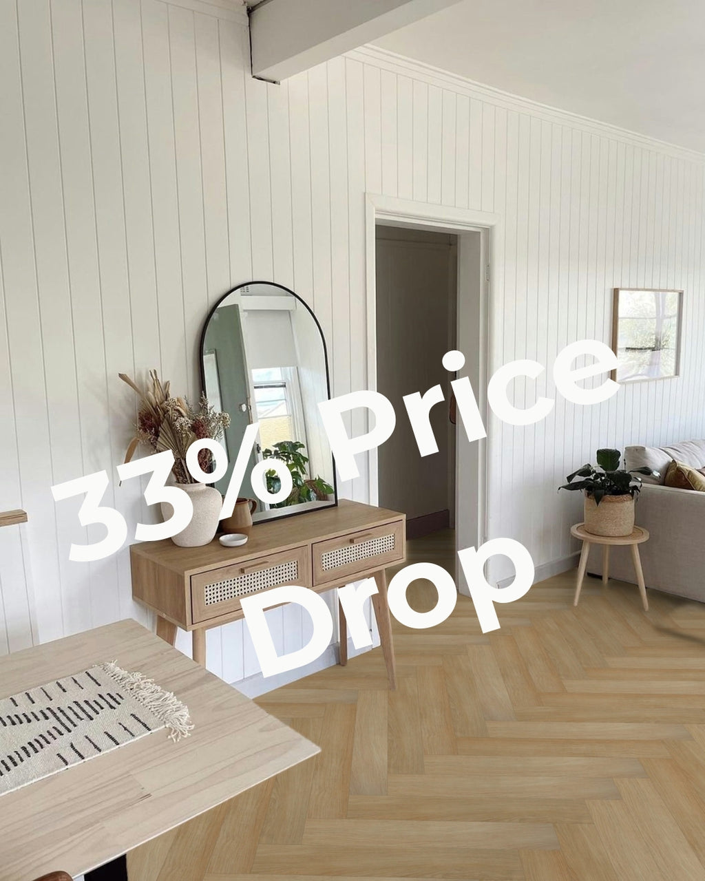 Sandhill hybrid flooring in a herringbone pattern. Matte finish, light oak-look planks with integrated acoustic backing.