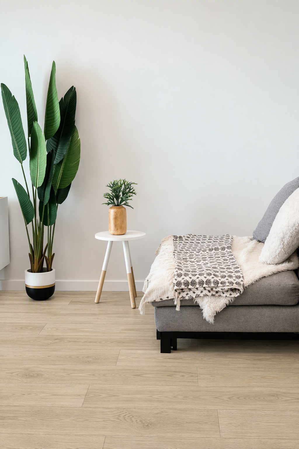 Ivory hybrid flooring, smooth matte. Durable waterproof planks with a pale cream finish and authentic timber-look grain.